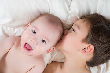 Image showing Mixed Race Chinese and Caucasian Baby Brothers Having Fun Laying