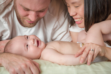 Image showing Mixed Race Chinese and Caucasian Baby Boy Laying In Bed with His