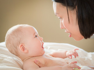 Image showing Mixed Race Chinese and Caucasian Baby Boy Laying In Bed with His