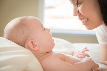 Image showing Mixed Race Chinese and Caucasian Baby Boy Laying In Bed with His