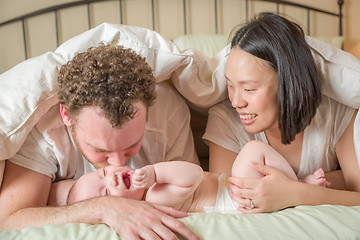 Image showing Mixed Race Chinese and Caucasian Baby Boy Laying In Bed with His