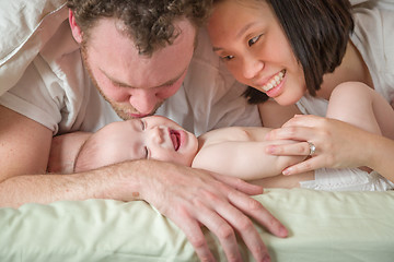 Image showing Mixed Race Chinese and Caucasian Baby Boy Laying In Bed with His