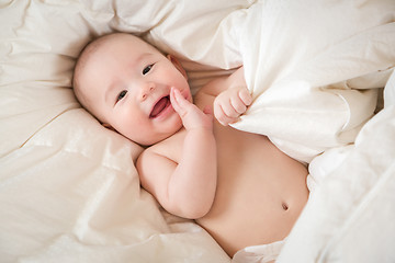 Image showing Mixed Race Baby Boy Having Fun on His Blanket