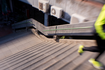 Image showing man jogging on steps