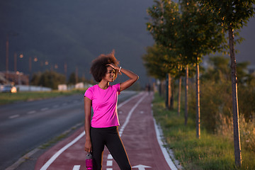 Image showing Portrait of a young african american woman running outdoors