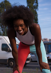 Image showing Portrait of sporty young african american woman running outdoors