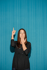 Image showing Portrait of young woman with shocked facial expression