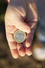 Image showing coin in the hands of a child