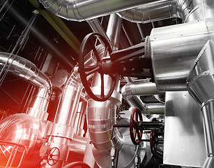 Image showing Equipment, cables and piping as found inside of a modern industr