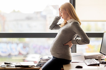 Image showing pregnant businesswoman feeling sick at office work