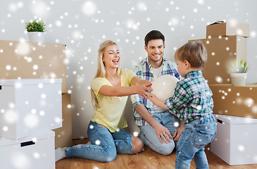 Image showing happy family moving to new home and playing ball