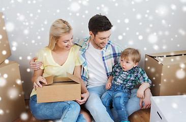 Image showing happy family with boxes moving to new home