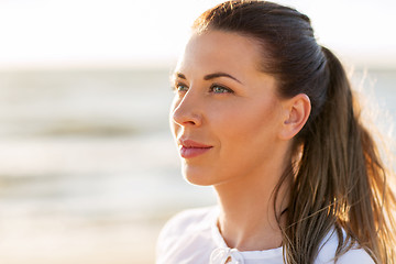 Image showing happy smiling young woman face outdoors