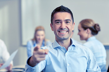 Image showing group of smiling businesspeople meeting in office