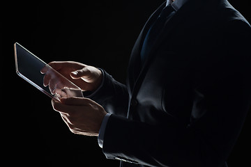 Image showing close up of businessman with transparent tablet pc