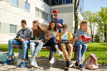 Image showing group of students with notebooks at school yard