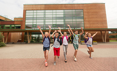 Image showing group of happy elementary school students running