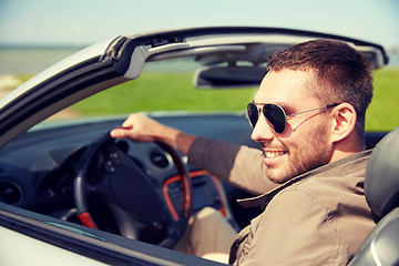 Image showing happy man driving cabriolet car outdoors