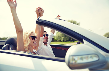 Image showing happy man and woman driving in cabriolet car