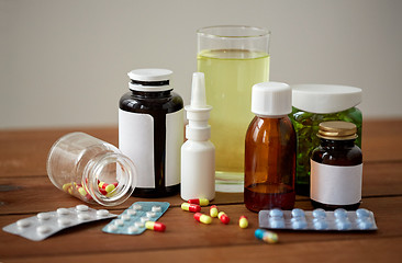 Image showing medicine and drugs on wooden table