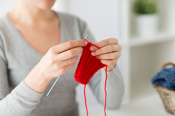 Image showing woman hands knitting with needles and yarn