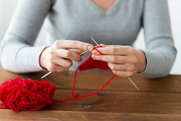 Image showing woman hands knitting with needles and yarn