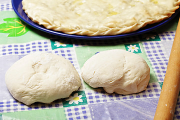 Image showing Two pieces of dough and pie