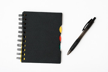 Image showing notepad with pen isolated