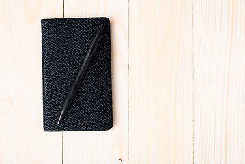 Image showing Small notepad with pen