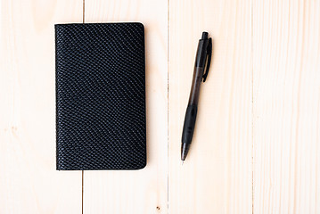 Image showing Small notepad with pen