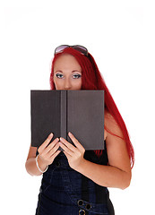 Image showing Woman with book and glasses.