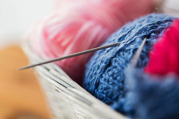 Image showing basket with knitting needles and balls of yarn