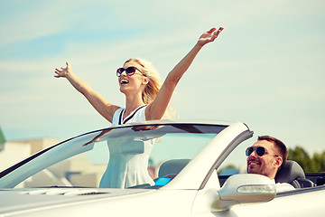 Image showing happy man and woman driving in cabriolet car