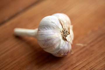 Image showing close up of garlic on wooden table