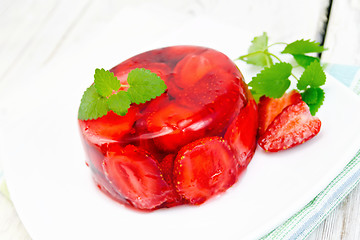 Image showing Jelly strawberry with mint and berries on light board