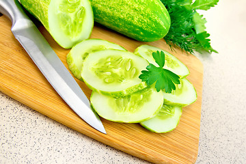 Image showing Cucumber with parsley on table