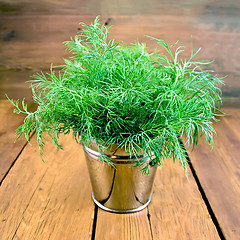 Image showing Dill in metal bucket on wooden board