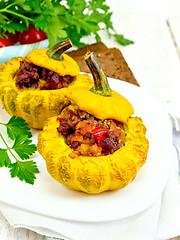 Image showing Squash yellow stuffed with meat on board