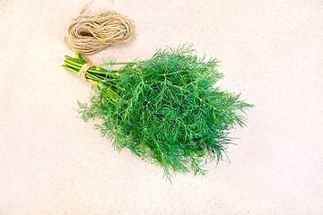 Image showing Dill with twine on granite table top