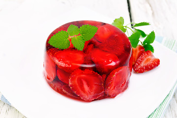 Image showing Jelly strawberry with mint on napkin and board