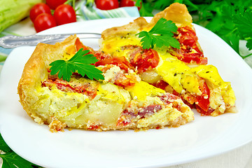 Image showing Flan with tomato and zucchini in plate on light board