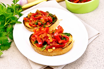 Image showing Bruschetta with tomatoes and peppers in plate on granite table