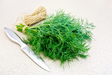 Image showing Dill with twine and knife on granite table