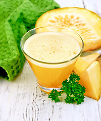 Image showing Juice pumpkin with napkin and parsley on board