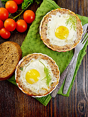 Image showing Tartlet meat with egg in pan on board top