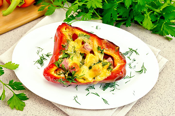 Image showing Pepper stuffed with sausage and cheese in plate