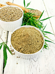 Image showing Flour hemp and grain in bowls on board