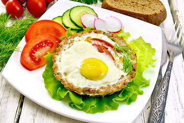 Image showing Tartlet meat with egg on board