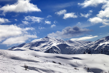 Image showing Ski slope and beautiful sky with clouds in sunny evening