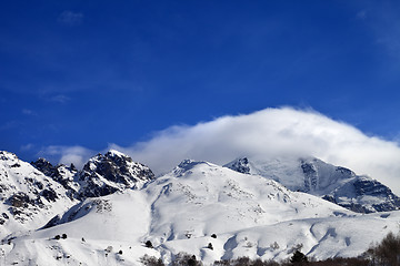 Image showing Mountains in clouds and off-piste slope in winter